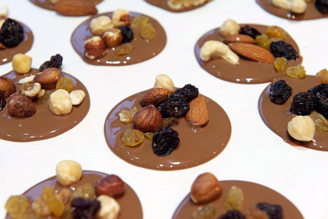 Brussels Chocolate Walking Tour and Workshop - Where the walk begins: Grand Place landmarks and the story behind the guildhouses